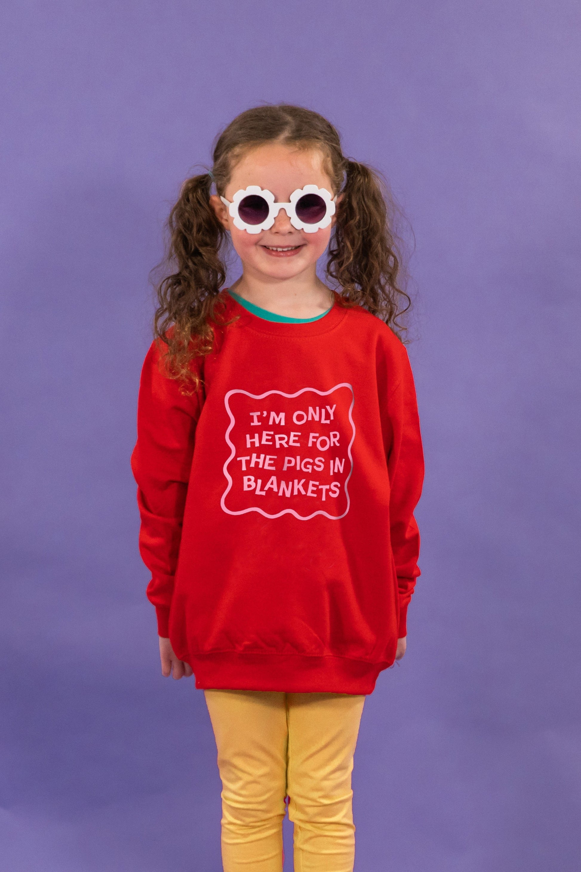 Funny Christmas Jumper for Children with I'm Only Here For The Pigs in Blankets Slogan Red with Pink Text