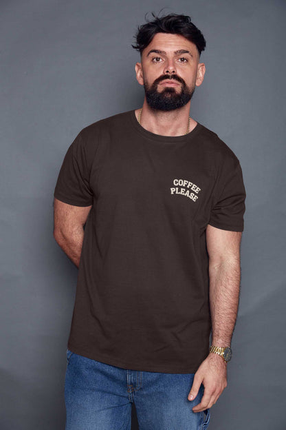 Man wearing a brown t-shirt with 'Coffee Please' text against a grey background