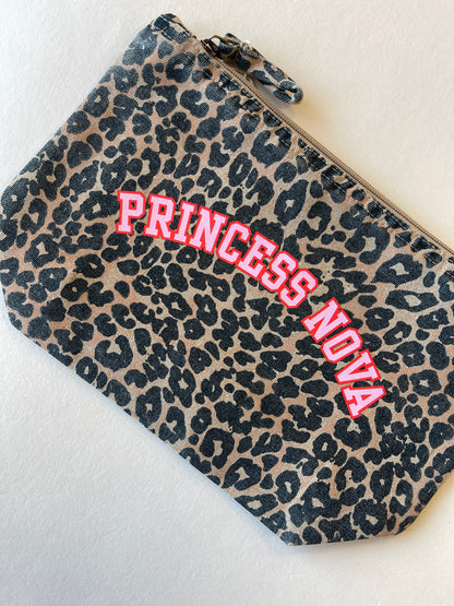 Leopard print zip pouch bag with 'Princess Nova' text in pink and red on a light background