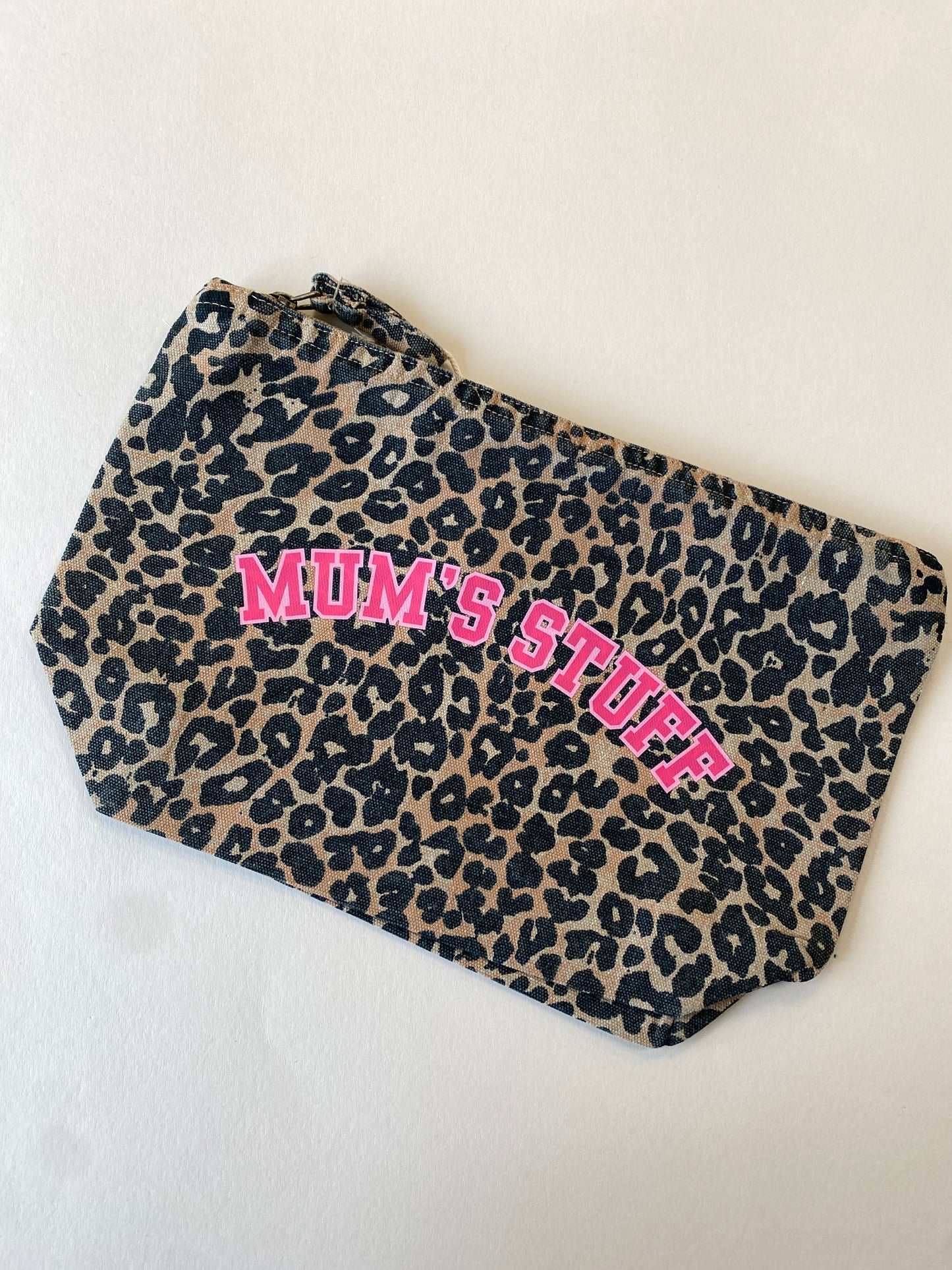 Leopard print pouch with 'Mum's Stuff' text in pink on a white background