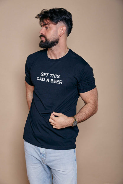man wearing a navy t shirt with the custom text 'get this dad a beer' printed on the chest
