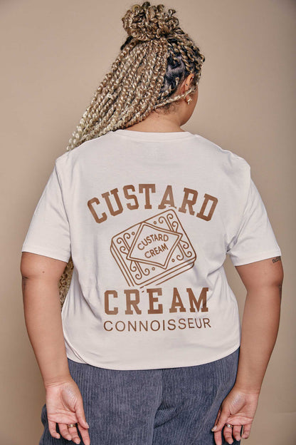 Person wearing a t-shirt with 'Custard Cream Connoisseur' text and graphics on the back.