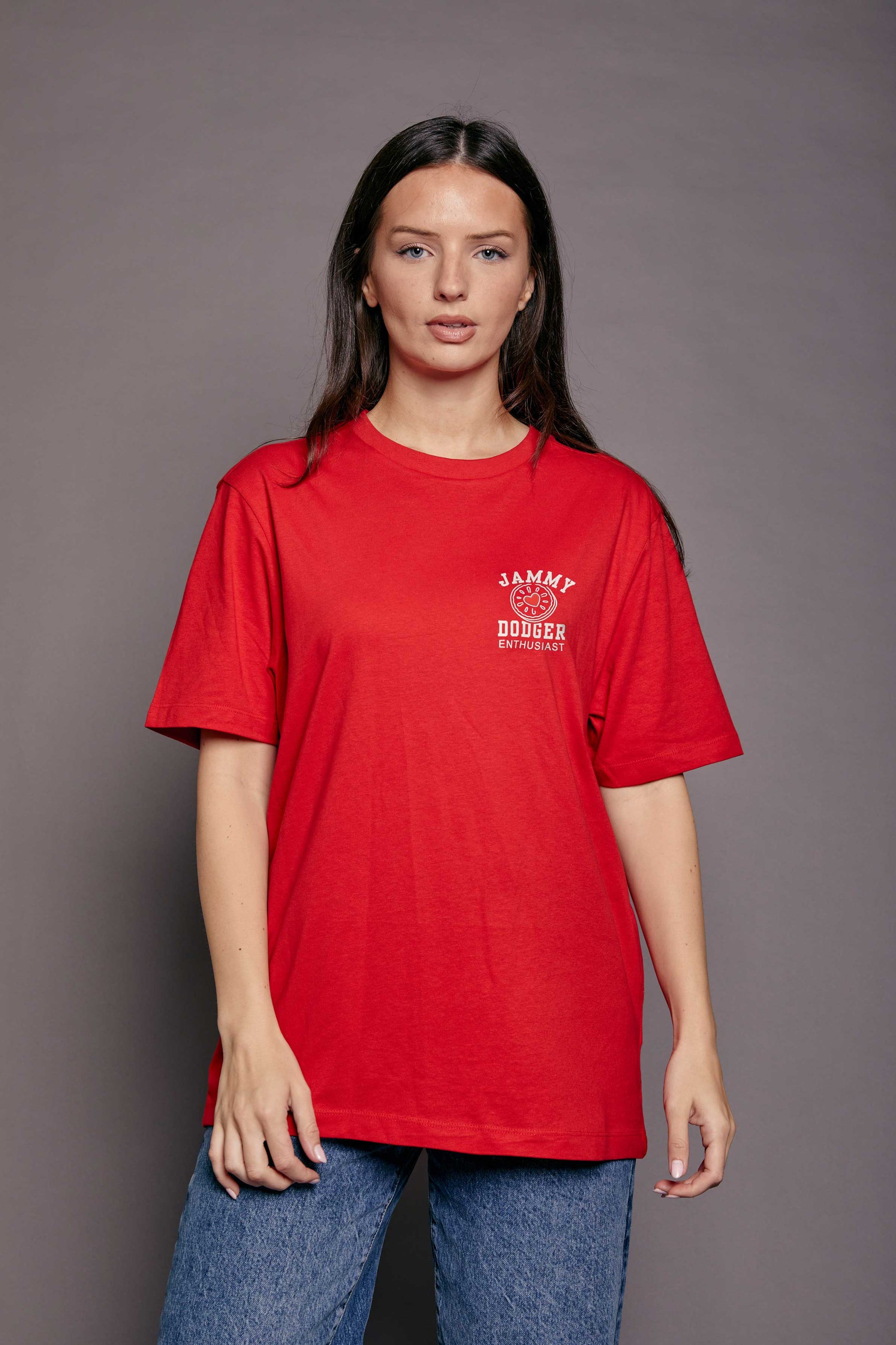 Woman wearing a red t-shirt with 'jammy dodger enthusiast' text on a grey background 