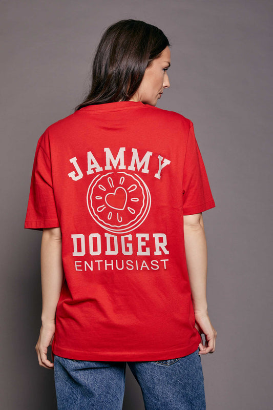 Person wearing a red t-shirt with 'Jammy Dodger Enthusiast' text on the back against a grey background