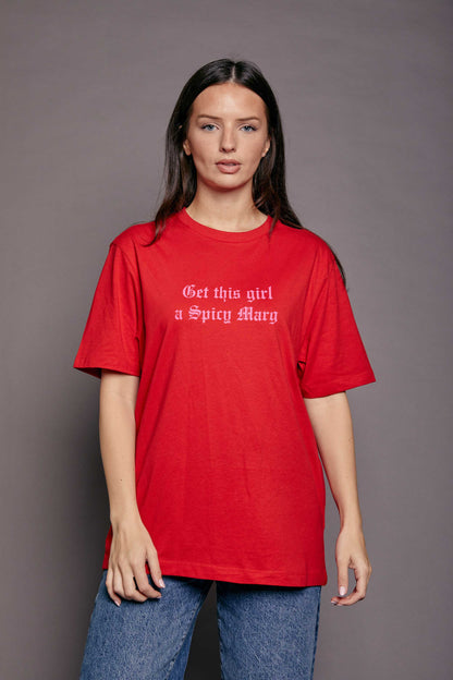 woman wearing a rd oversized t shirt with the slogan 'get this girl a spicy marg' in pink old english style font